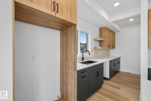 7087 Kiviaq Crescent, Edmonton, AB - Indoor Photo Showing Kitchen With Double Sink