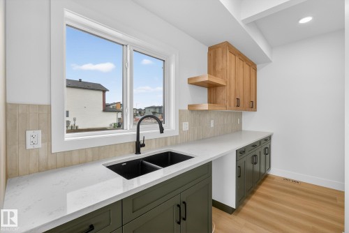 7087 Kiviaq Crescent, Edmonton, AB - Indoor Photo Showing Kitchen With Double Sink