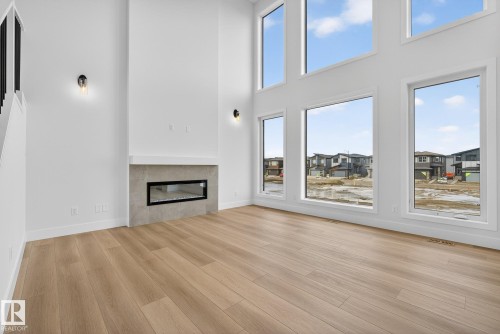 7087 Kiviaq Crescent, Edmonton, AB - Indoor Photo Showing Living Room With Fireplace