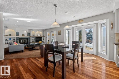 17715 57 Avenue, Edmonton, AB - Indoor Photo Showing Dining Room With Fireplace