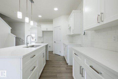 600 Ashgrove Circle, Leduc, AB - Indoor Photo Showing Kitchen With Double Sink With Upgraded Kitchen