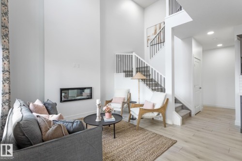 15772 7 Street Ne, Edmonton, AB - Indoor Photo Showing Living Room With Fireplace