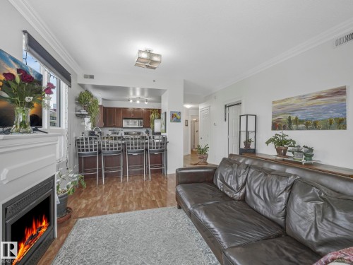 1005 9939 109 Street, Edmonton, AB - Indoor Photo Showing Living Room With Fireplace
