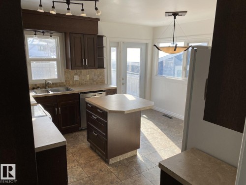 7921 97 Avenue, Edmonton, AB - Indoor Photo Showing Kitchen With Double Sink