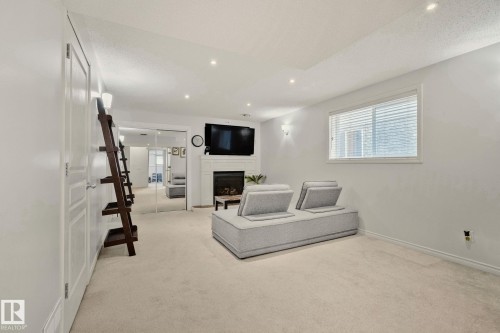 4751 156 Avenue, Edmonton, AB - Indoor Photo Showing Other Room With Fireplace