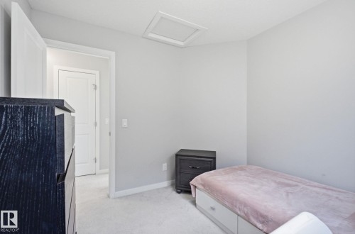 The room features light gray walls and light-colored carpeting - 17498 76 St Nw, Edmonton, AB - Indoor Photo Showing Bedroom