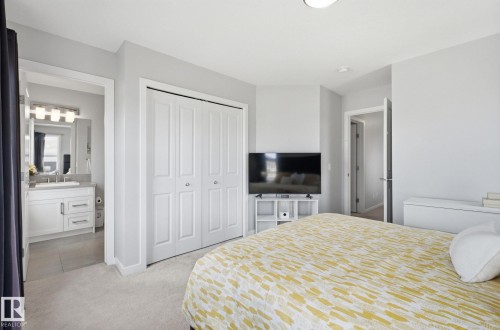 This bright room features light-colored carpeting and walls - 17498 76 St Nw, Edmonton, AB - Indoor Photo Showing Bedroom