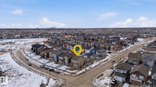 An aerial view showcasing a residential neighborhood with detached properties and paved streets - 17498 76 St Nw, Edmonton, AB - Outdoor With View