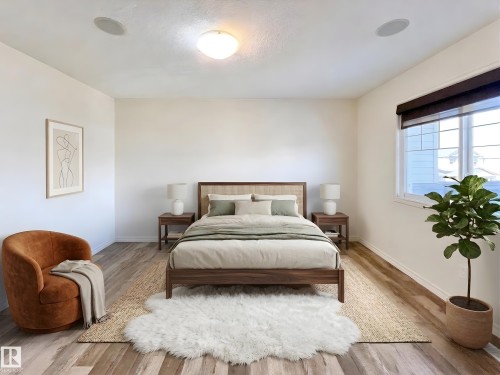 Bedroom featuring light-colored walls, wood-style flooring, a large window with blinds, and ceiling-mounted light fixtures - 17127 7A Avenue, Edmonton, AB - Indoor Photo Showing Bedroom