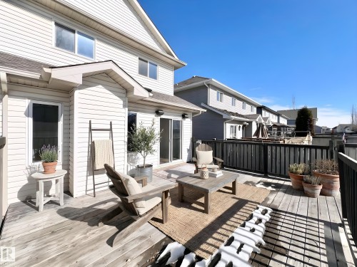 The property features an expansive outdoor deck with wooden fencing - 17127 7A Avenue, Edmonton, AB - Outdoor With Deck Patio Veranda With Exterior