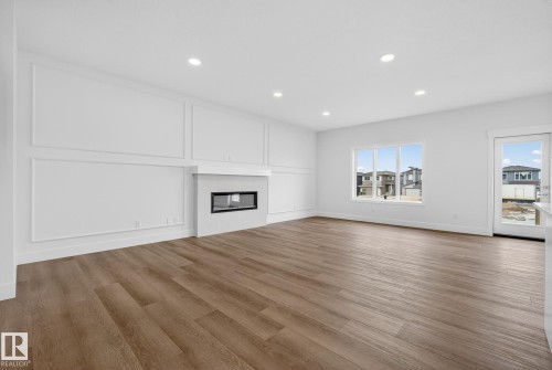7091 Kiviaq Crescent, Edmonton, AB - Indoor Photo Showing Living Room With Fireplace