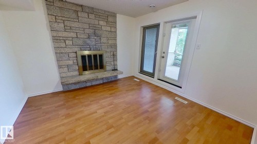 3432 81 Street, Edmonton, AB - Indoor Photo Showing Other Room With Fireplace
