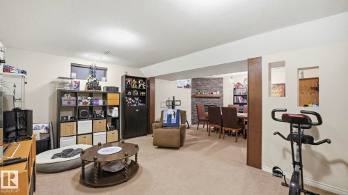 Spacious open concept living area with carpeted flooring - 10922 117 Street, Edmonton, AB - Indoor Photo Showing Other Room