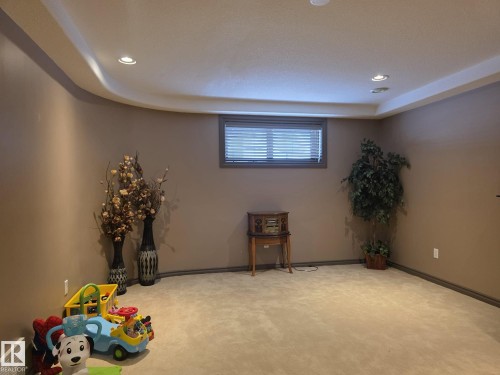 This room features plush carpeting and recessed lighting - 4477 36 Street, Drayton Valley, AB - Indoor Photo Showing Other Room