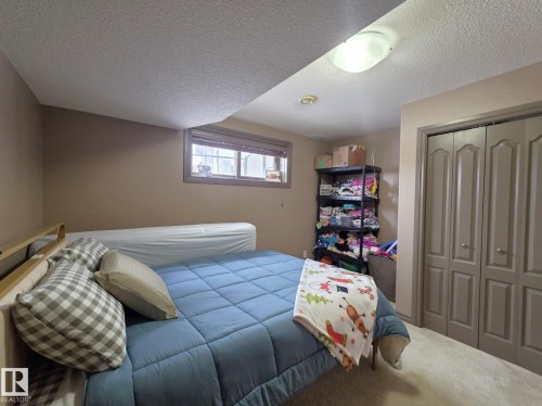 This room features neutral-toned walls, a window with blinds, and light-colored carpeting - 4477 36 Street, Drayton Valley, AB - Indoor