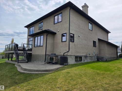 Stucco exterior with black-framed windows - 4477 36 Street, Drayton Valley, AB - Outdoor With Exterior