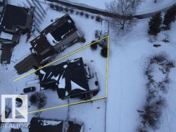 Aerial view of the property, showcasing its position within the surrounding neighborhood - 