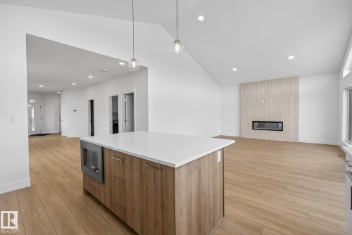 7093 Kiviaq Crescent, Edmonton, AB - Indoor Photo Showing Other Room With Fireplace