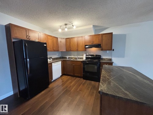 40 13590 38 Street, Edmonton, AB - Indoor Photo Showing Kitchen With Double Sink