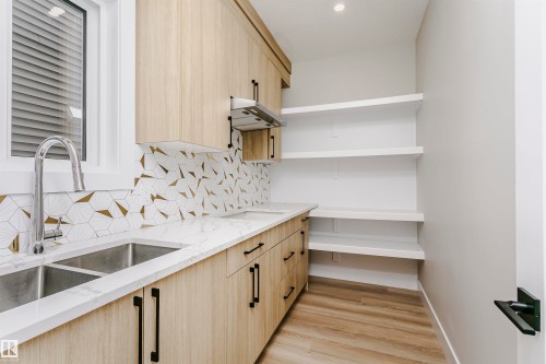 8411 Mayday Link Link, Edmonton, AB - Indoor Photo Showing Kitchen With Double Sink