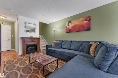 207 105 Mckenney Ave, St. Albert, AB - Indoor Photo Showing Living Room With Fireplace