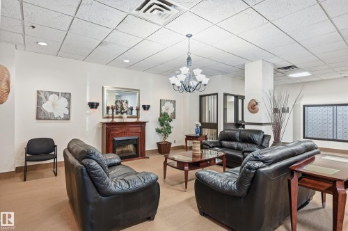 1910 10149 Saskatchewan Drive, Edmonton, AB - Indoor Photo Showing Living Room With Fireplace