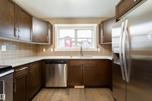 122 401 Southfork Drive, Leduc, AB - Indoor Photo Showing Kitchen With Stainless Steel Kitchen With Double Sink