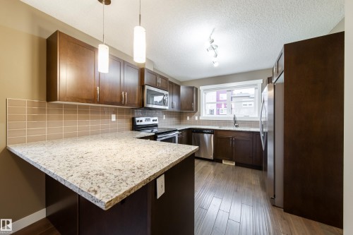 122 401 Southfork Drive, Leduc, AB - Indoor Photo Showing Kitchen With Double Sink With Upgraded Kitchen