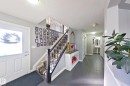 The property features a welcoming entryway with light gray walls and dark tile flooring - 1743 60 Street Sw, Edmonton, AB  - Indoor Photo Showing Other Room 