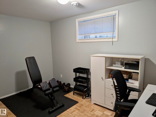 Versatile room featuring light grey walls, a window with blinds, and parquet flooring - 10645 65 Avenue, Edmonton, AB - Indoor Photo Showing Office