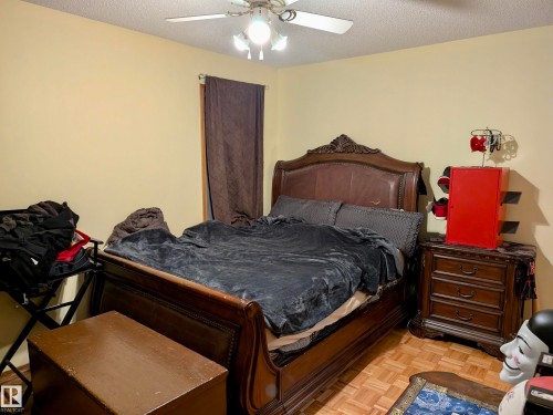 This room features light-colored walls and a ceiling fan with integrated lighting - 10645 65 Avenue, Edmonton, AB - Indoor Photo Showing Bedroom
