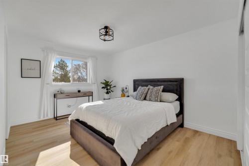 This room features light-colored flooring and white walls, creating a bright and airy atmosphere - 131 West Liberty Crescent, Millet, AB - Indoor Photo Showing Bedroom