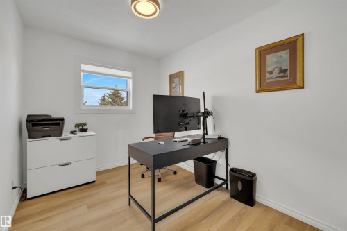 Bright room featuring light-toned flooring, white walls, and a window providing natural light - 131 West Liberty Crescent, Millet, AB - Indoor Photo Showing Office