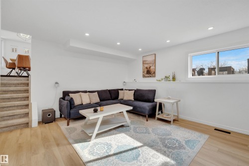 Living area with light wood flooring, recessed lighting, and a large window providing natural light - 131 West Liberty Crescent, Millet, AB - Indoor Photo Showing Living Room