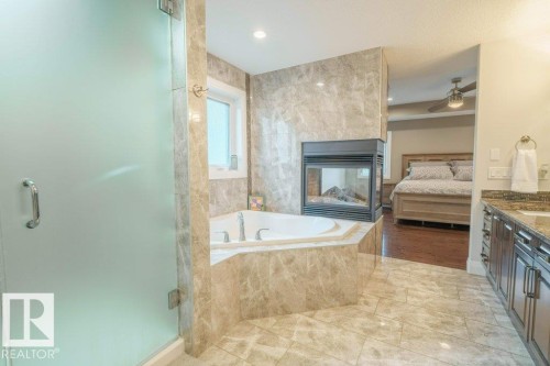 6111 56 Avenue, Beaumont, AB - Indoor Photo Showing Bathroom With Fireplace