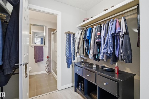 This property features a closet with a built-in storage unit, overhead shelving, and hanging rods - 115 2208 44 Avenue, Edmonton, AB - Indoor With Storage