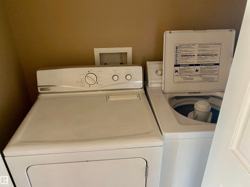 Laundry area with washer and clothes dryer - 403 178 Bridgeport Boulevard, Leduc, AB - Indoor Photo Showing Laundry Room
