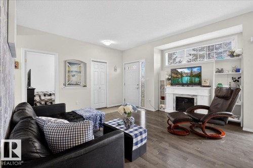 17 1179 Summerside Drive, Edmonton, AB - Indoor Photo Showing Living Room With Fireplace