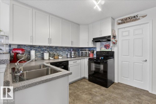 17 1179 Summerside Drive, Edmonton, AB - Indoor Photo Showing Kitchen With Double Sink