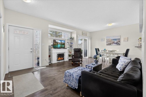 17 1179 Summerside Drive, Edmonton, AB - Indoor Photo Showing Living Room With Fireplace