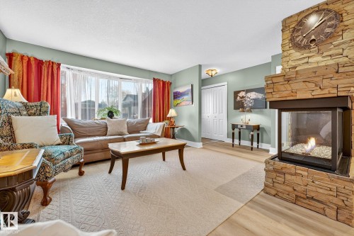 4664 16A Avenue, Edmonton, AB - Indoor Photo Showing Living Room With Fireplace