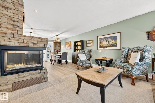 4664 16A Avenue, Edmonton, AB - Indoor Photo Showing Living Room With Fireplace