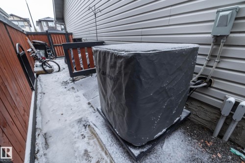 The property exterior features horizontal siding and a fenced yard - 7608 179 Avenue, Edmonton, AB - Outdoor With Exterior