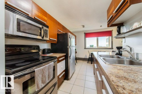 1007 9028 Jasper Avenue, Edmonton, AB - Indoor Photo Showing Kitchen With Double Sink