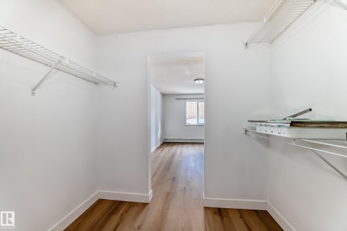 The property features a closet with wire shelving and durable wood-look flooring - 126 16221 95 Street, Edmonton, AB - Indoor With Storage