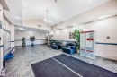 The property features an inviting common area with tiled flooring, comfortable seating, and convenient mailboxes - 126 16221 95 Street, Edmonton, AB  - Indoor Photo Showing Other Room 