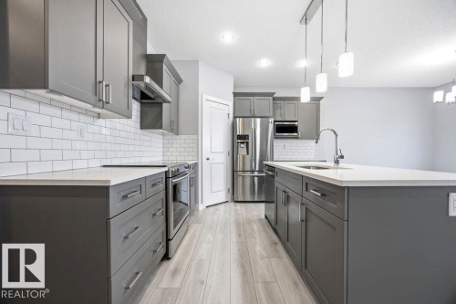1057 Coopers Hawk Link, Edmonton, AB - Indoor Photo Showing Kitchen With Stainless Steel Kitchen With Upgraded Kitchen