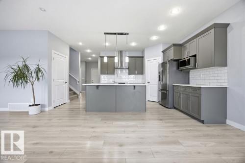 1057 Coopers Hawk Link, Edmonton, AB - Indoor Photo Showing Kitchen With Upgraded Kitchen