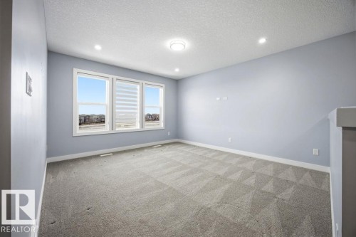 1057 Coopers Hawk Link, Edmonton, AB - Indoor Photo Showing Other Room