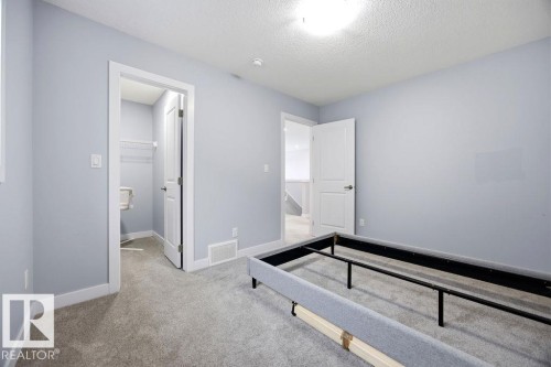 1057 Coopers Hawk Link, Edmonton, AB - Indoor Photo Showing Other Room